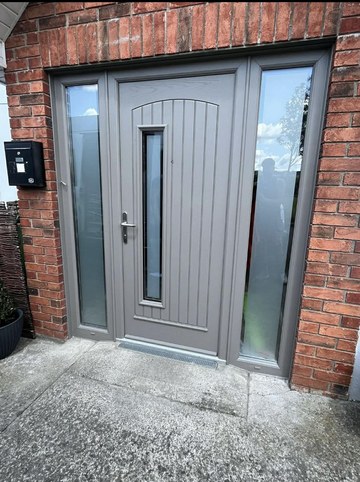 Grey composite door with sidelights