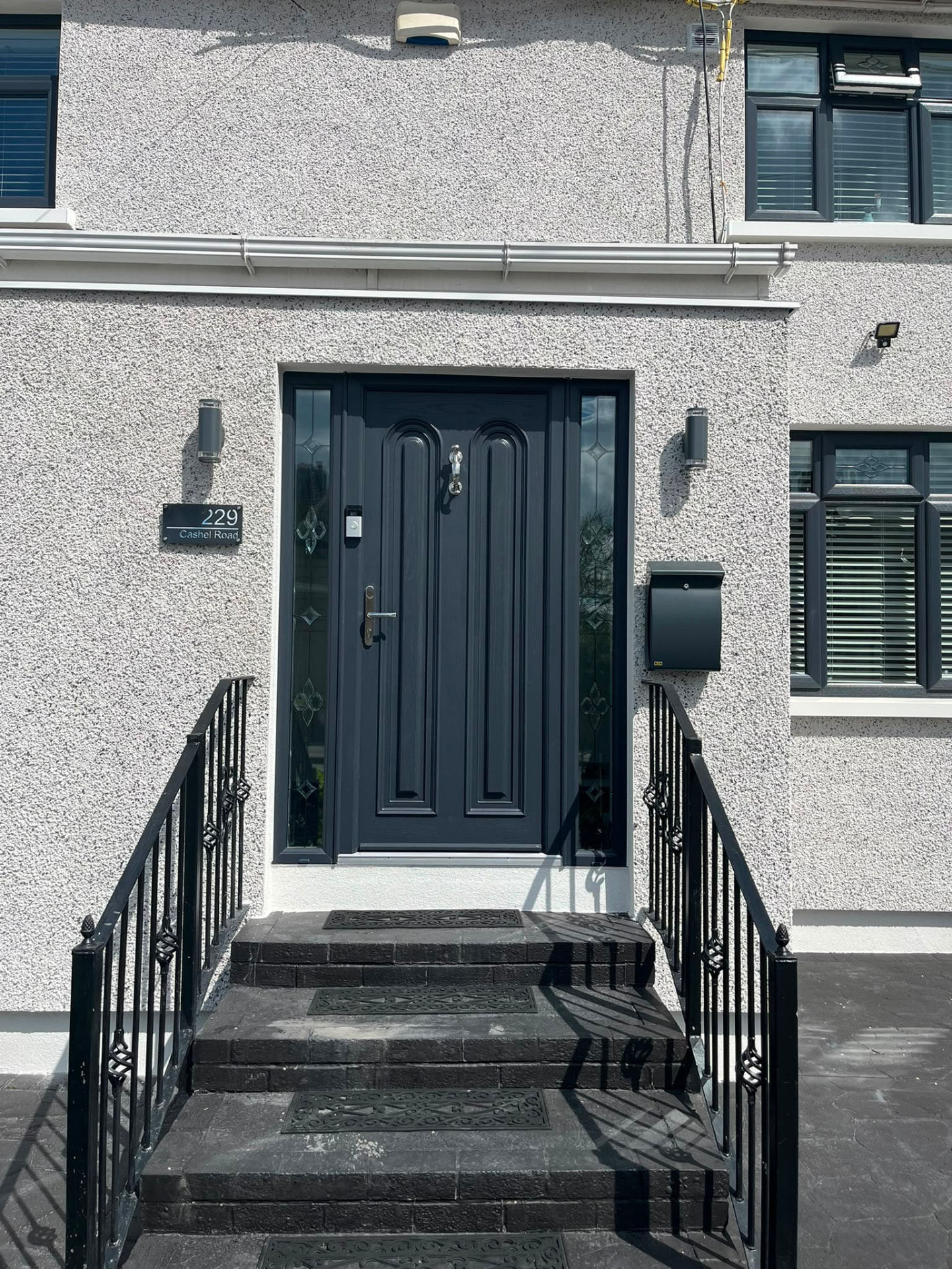 Anthracite grey composite front door with leaded decorative glass sidelights