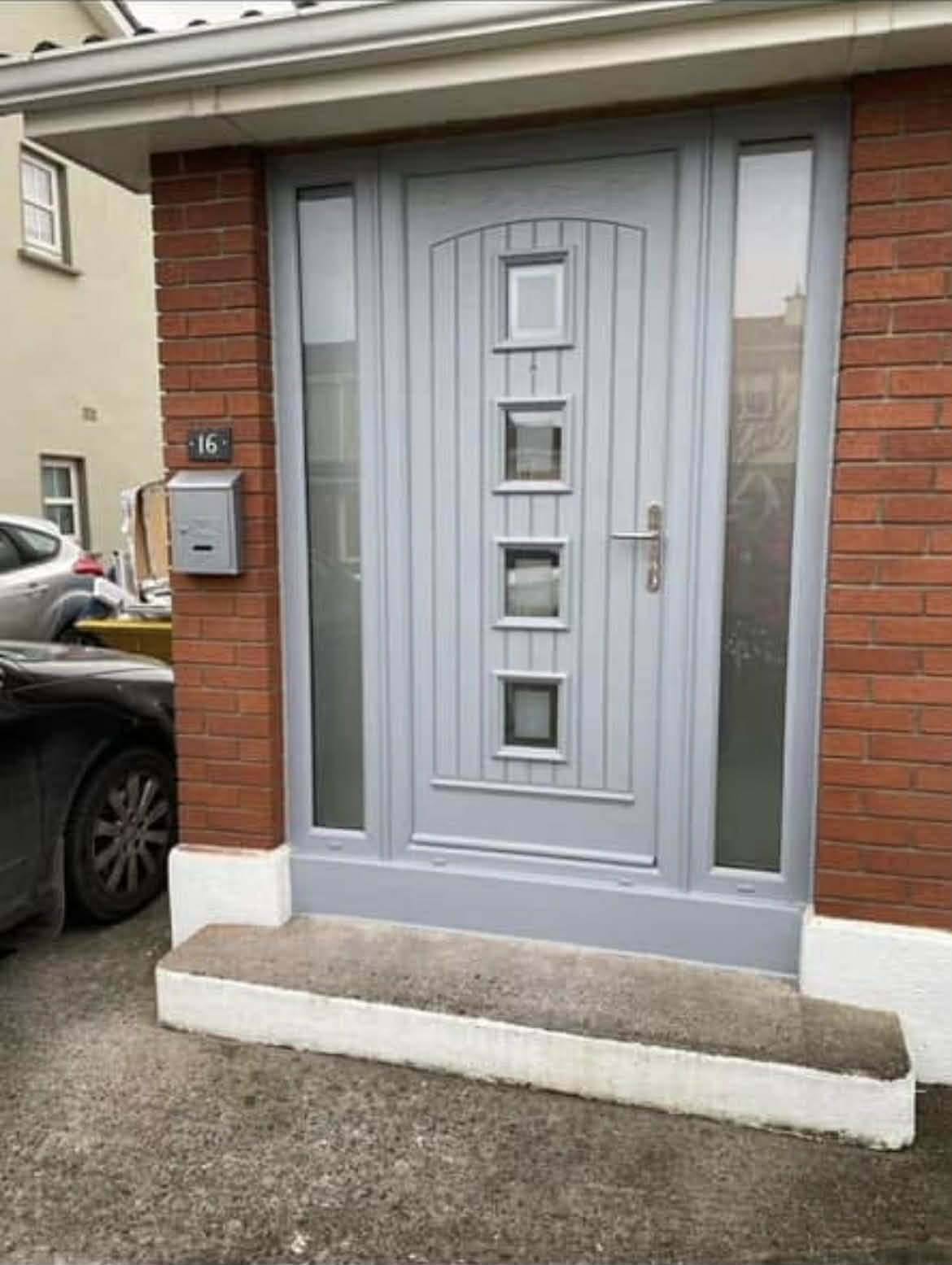 Light grey composite door with decorative glass