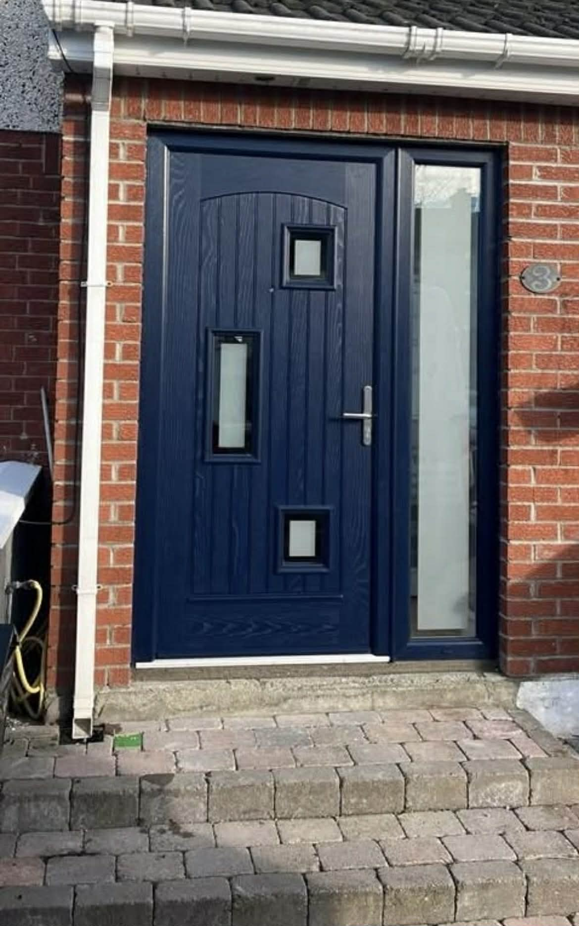 Navy blue composite door with sidelight