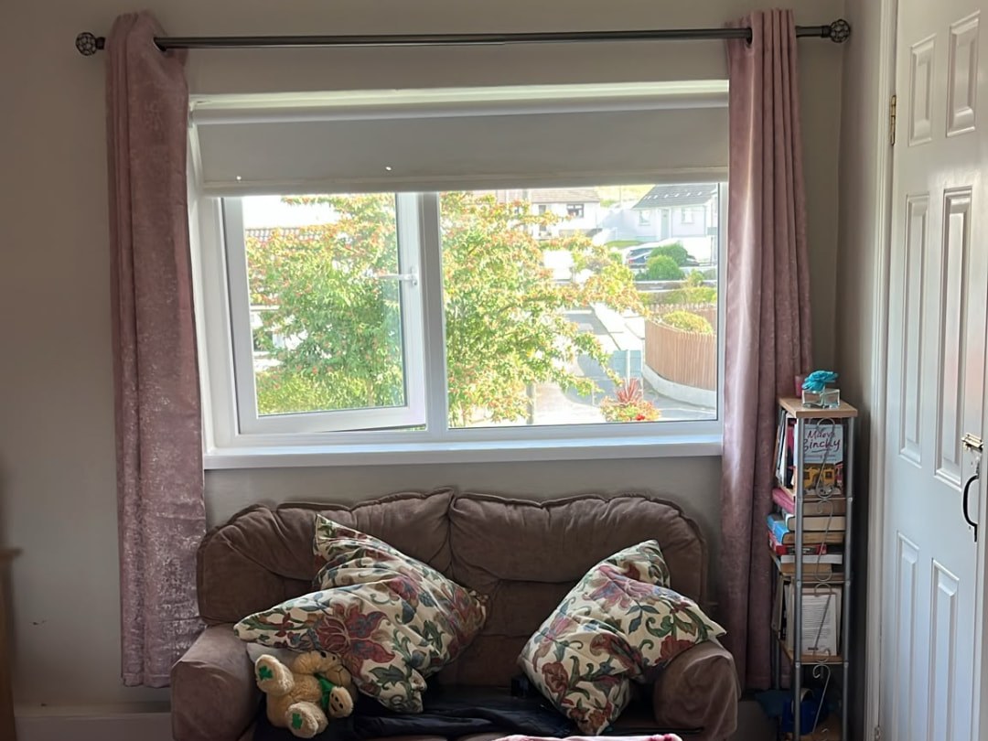 White uPVC casement window in a Dublin bedroom, dual-colour frames with grey outside and white inside