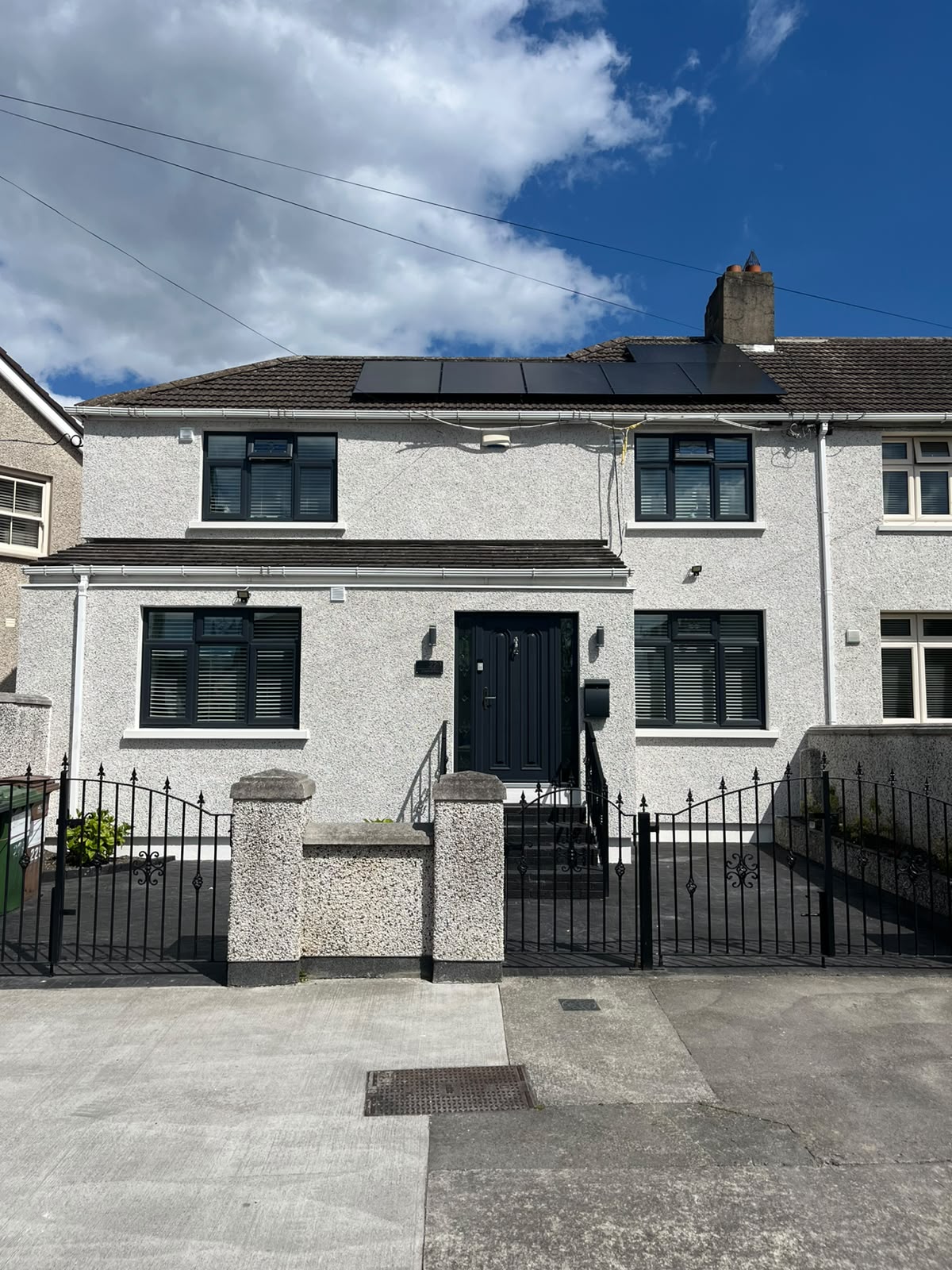 Anthracite grey windows and black composite door on a pebble dash Dublin home